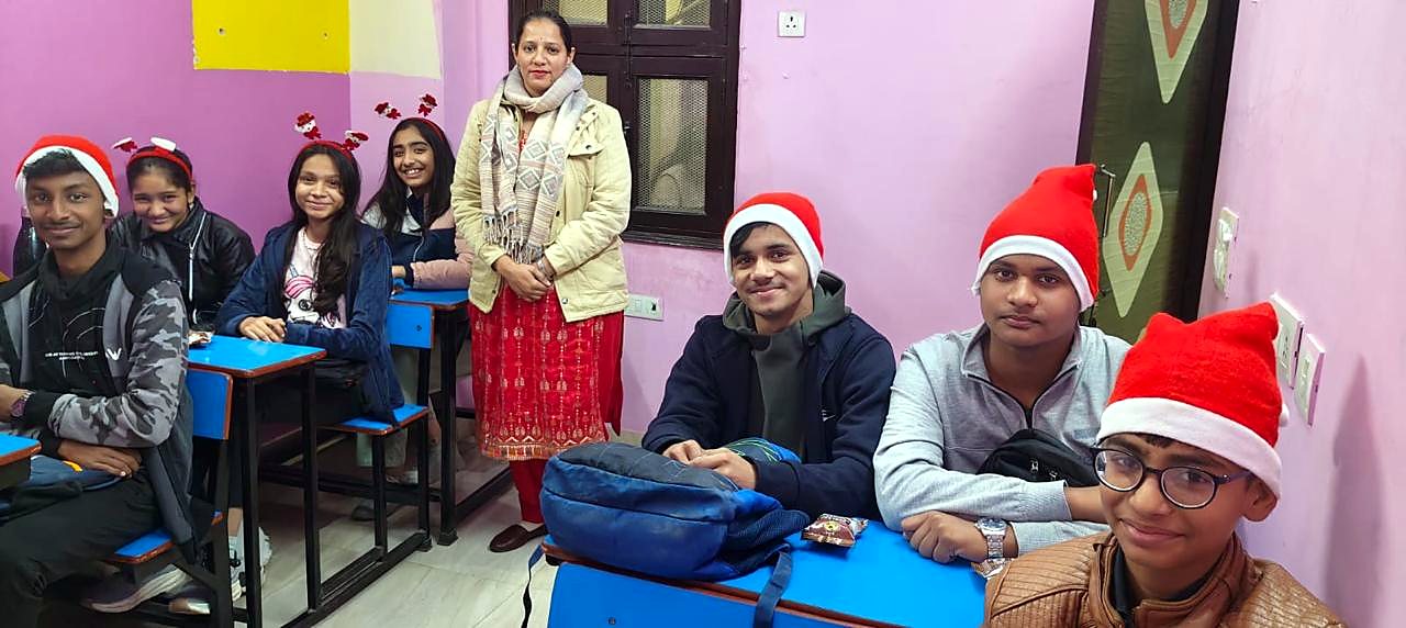 Pooja Yadav with students in classroom